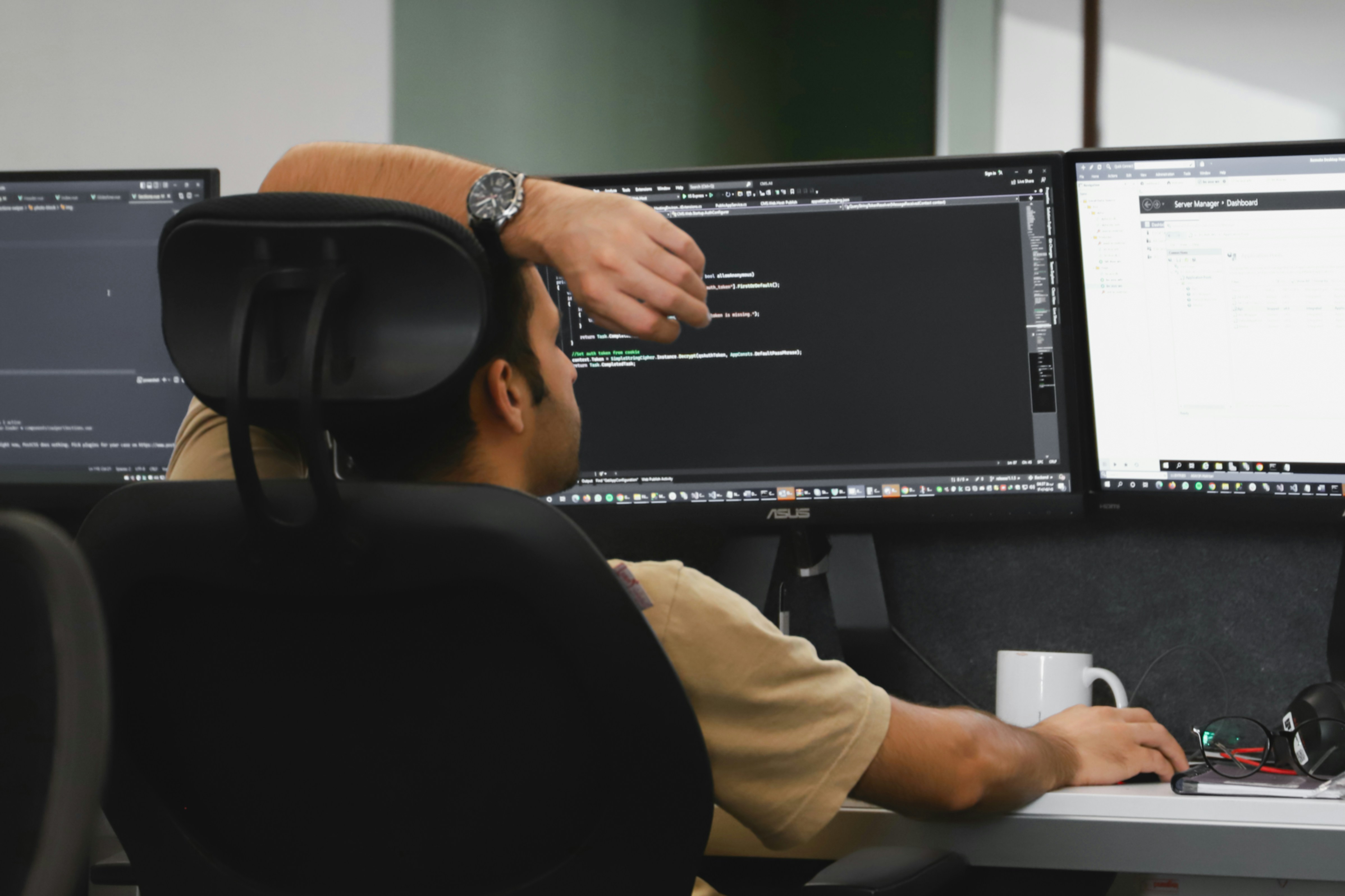 A man building a website at his computer.